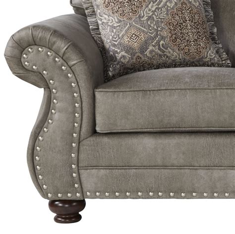 gray leather couch with nailhead